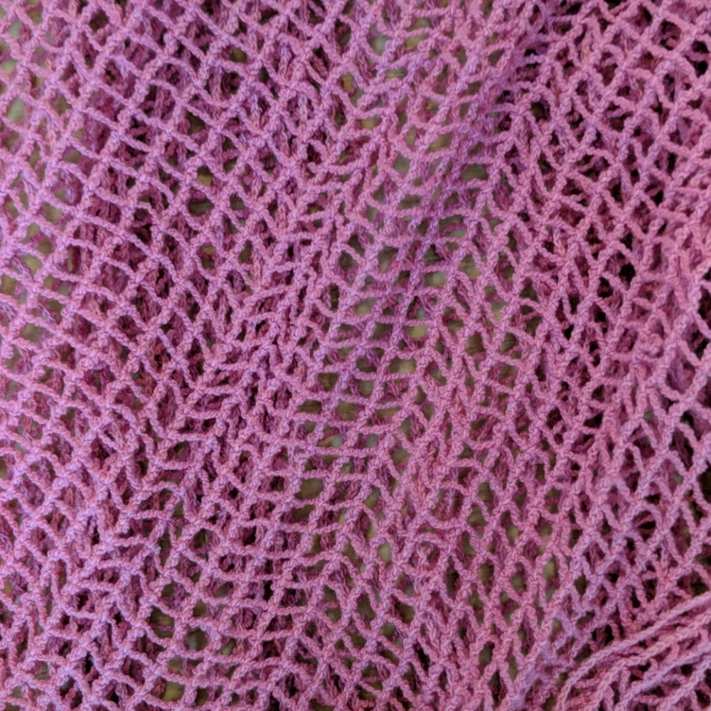 Long pink net scarf.